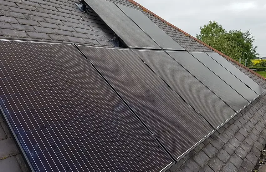 Black on-roof solar panel installation by Carbon Legacy